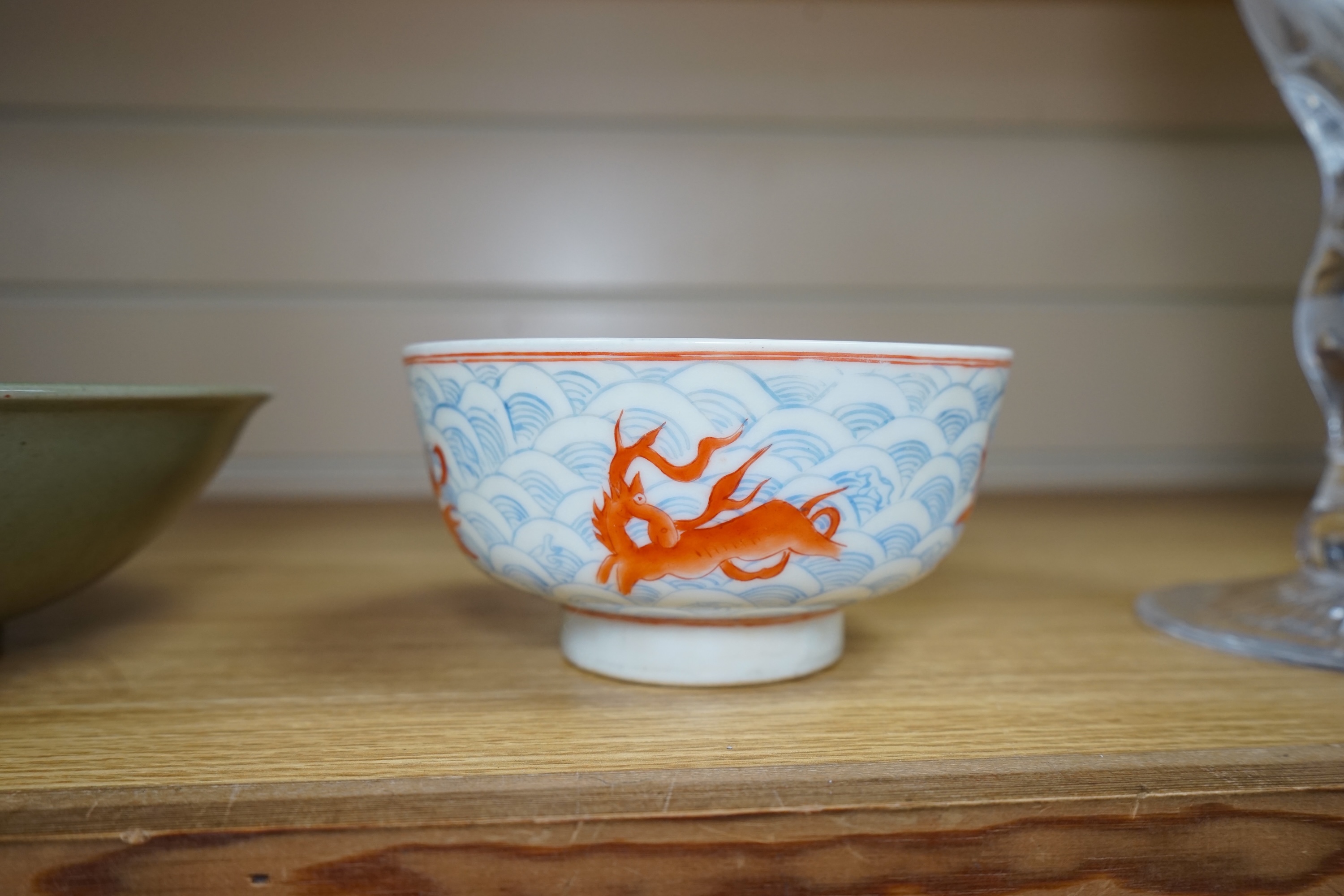 A Chinese Celadon glazed bowl and another, largest 19.5cm diameter. Condition - some wear